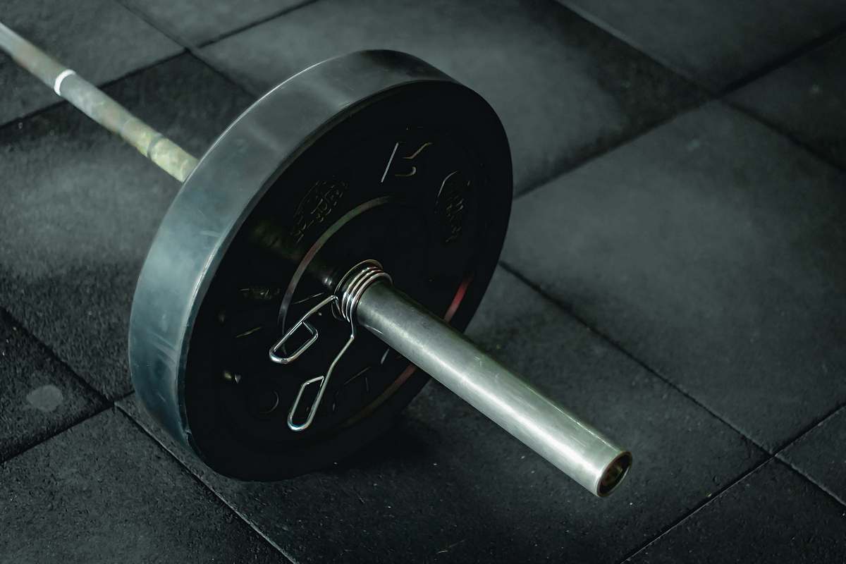 working out black barbell fitness